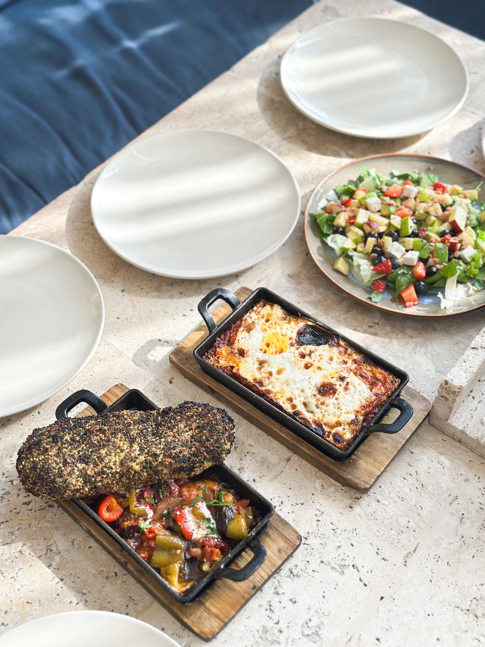 Table spread with natural wine and rustic Japanese plates
